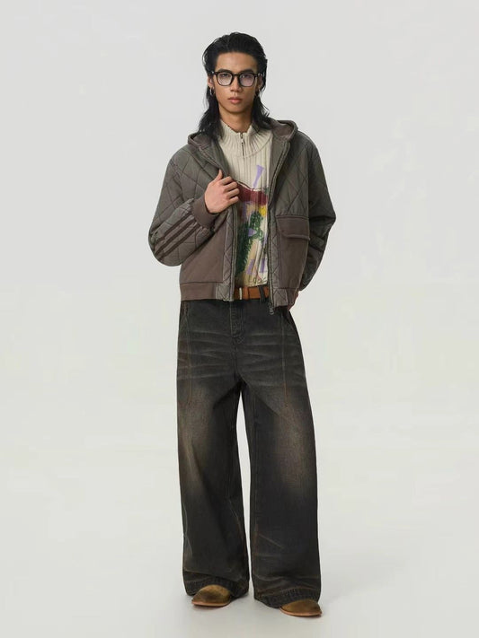 Person wearing a brown jacket, patterned shirt, and dark jeans on a white background